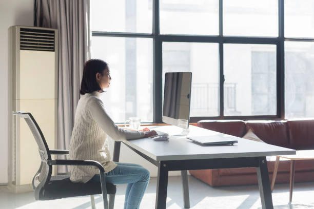 istock young woman working on computer in home office 928157996