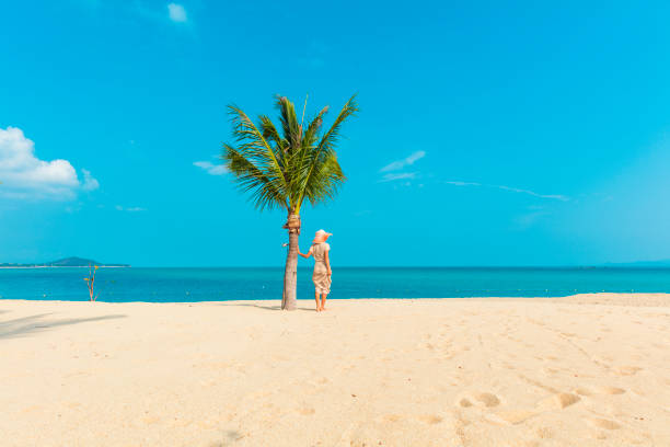 istock Woman at tropical beach 928159340