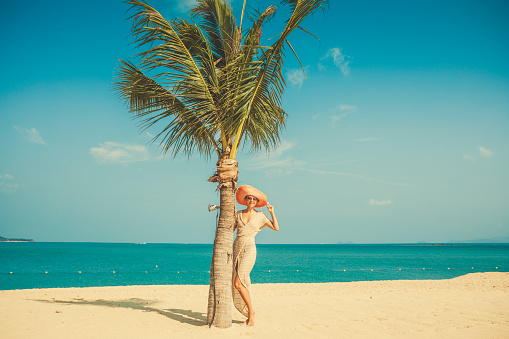 Woman posing at tropical beach