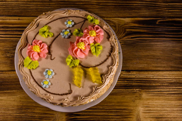 istock Kiev cake with cream on wooden table. Top view 928159392