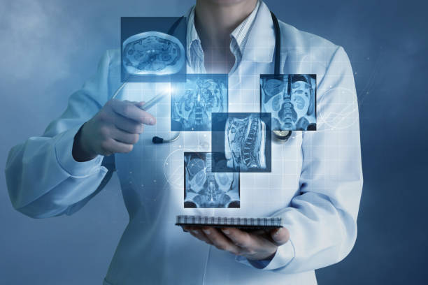 Doctor sees virtual images of the patient . Doctor sees virtual images of the patient on a blue background. digital xray stock pictures, royalty-free photos & images