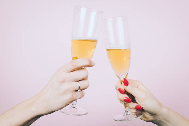 istock Close up of Two woman hands making good cheer 928162120