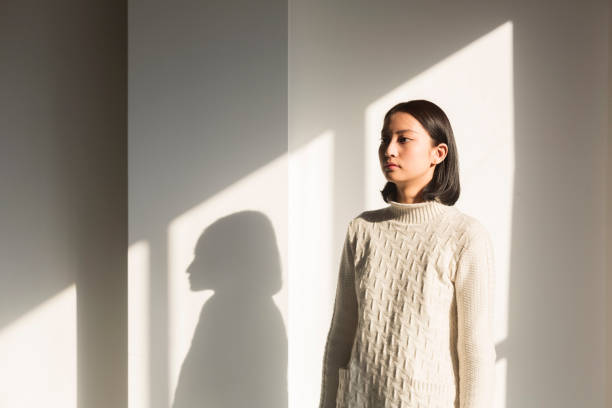 istock shadow of young woman,portrait 928166620