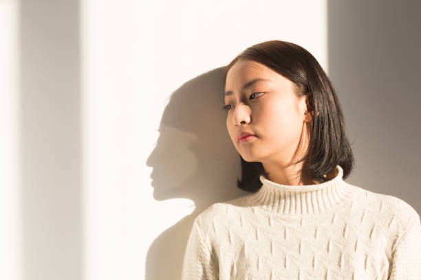 istock shadow of young woman,portrait 928166944
