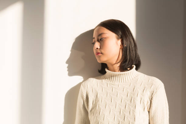 istock shadow of young woman,portrait 928166946