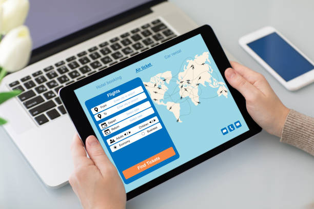 istock female hands holding tablet with application search air ticket screen 928169612