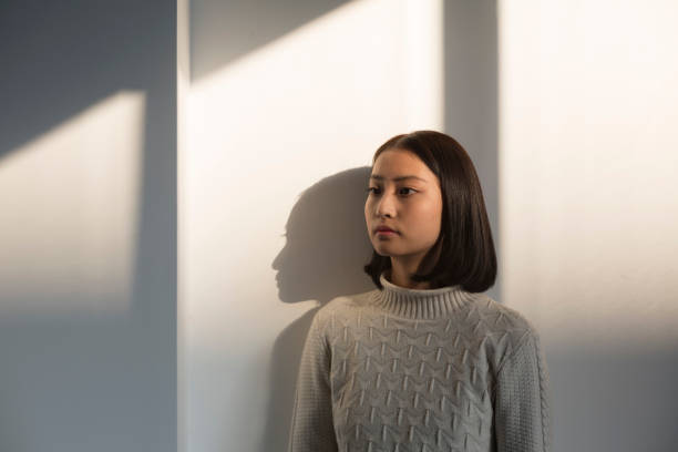 istock shadow of young woman,portrait 928169624