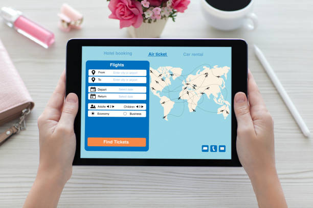 istock woman hands holding tablet computer with application search air ticket 928169806