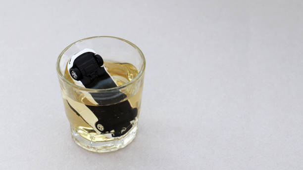istock A glass and miniature motor car. 928177466