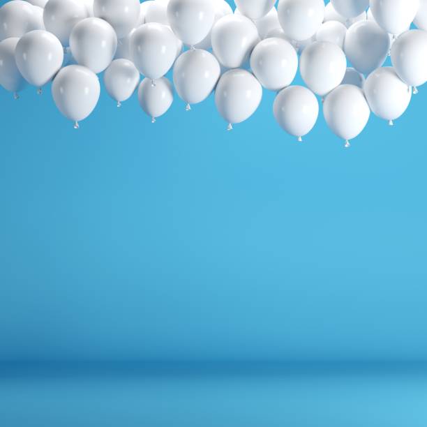 istock White balloons floating in blue pastel background room studio. minimal idea creative concept. 928181270