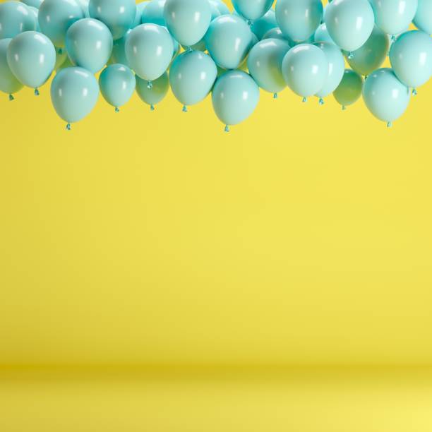 istock Blue balloons floating in yellow pastel background room studio. minimal idea creative concept. 928181274