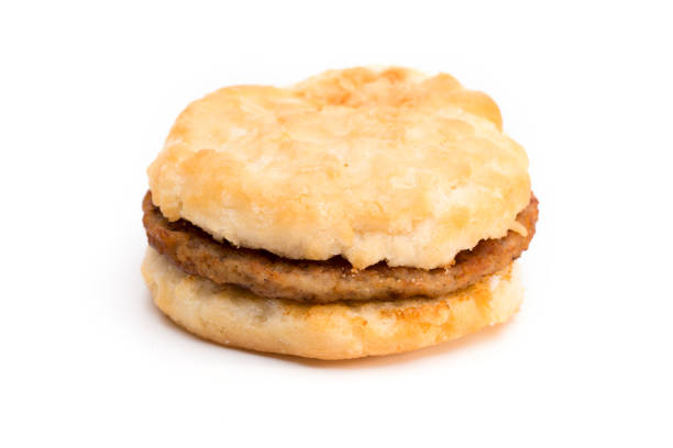 Sausage Biscuit Breakfast Sandwich on a White Background Breakfast Sandwich on a White Background biscuit quick bread photos stock pictures, royalty-free photos & images