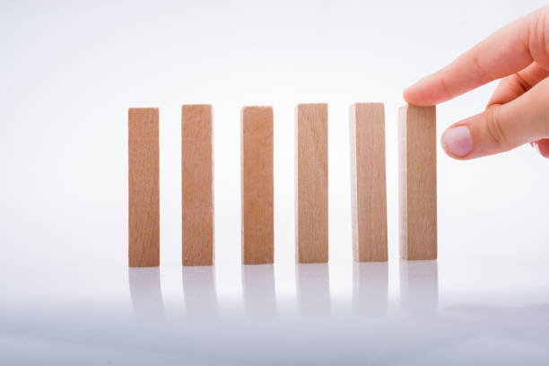 istock Hand holding wooden domino 928188144