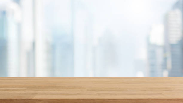 istock Empty wood table top and blur glass window wall building background with vintage filter - can used for display or montage your products. 928192272