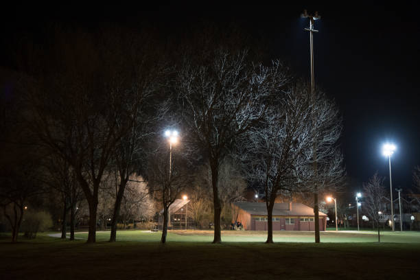 istock City park with a baseball field and building at night 928192898