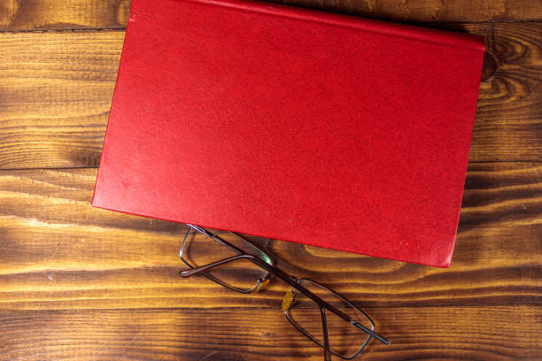red book isolated on a white background (with glasses)