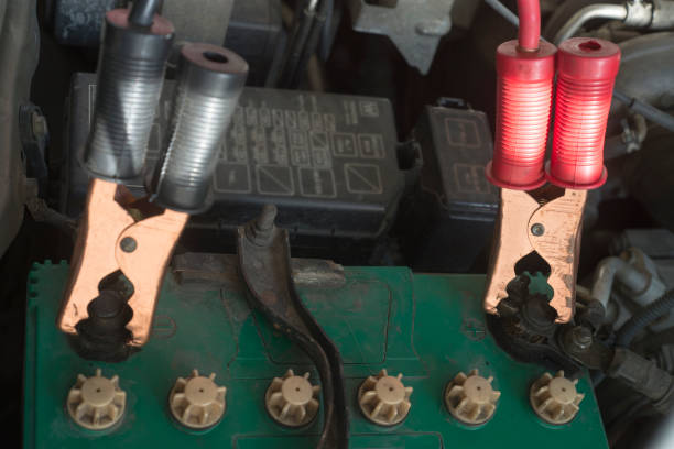 istock Charging car with booster jumper cable. Selective focus. 928196912
