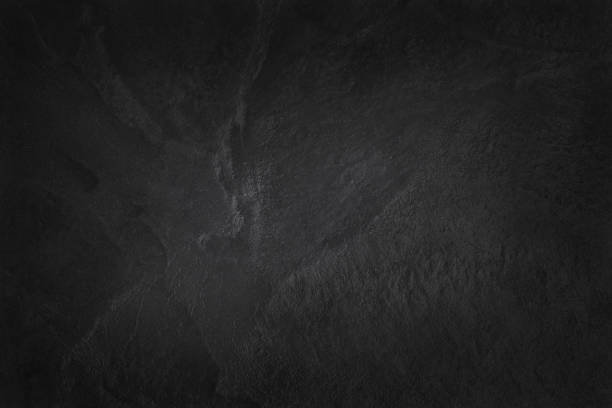 istock Dark grey black slate texture in natural pattern with high resolution for background and design art work. Black stone wall. 928201972