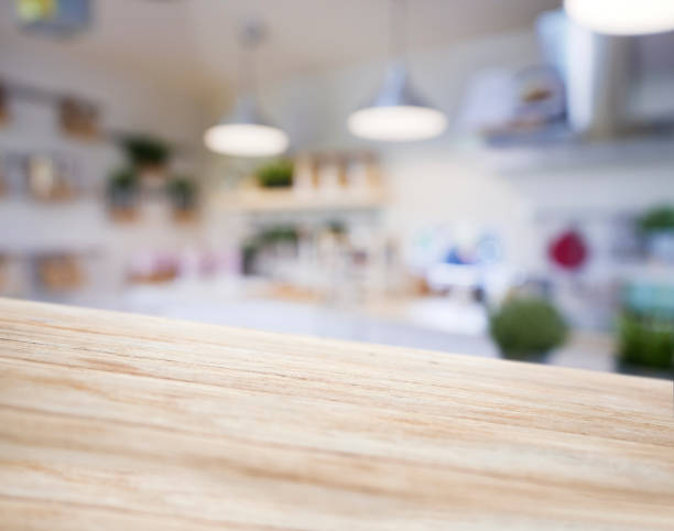 istock Table top wooden counter Blur Kitchen shelf background 928214092