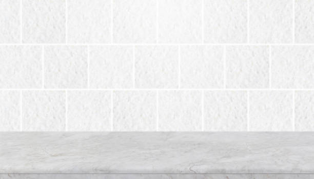 istock Empty white stone table top and background of grey granite stone tile wall - can used for display or montage your products. 928214860