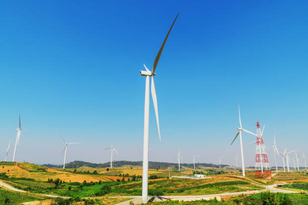 istock wind turbines on the hill with blue sky background 928218322