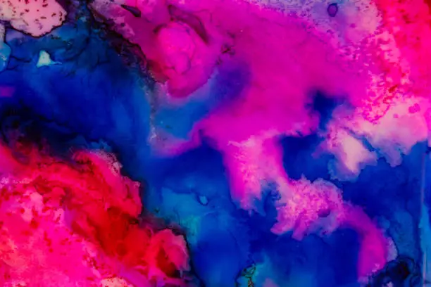 Handmade watercolor with blue, purple and red. Useable as a background or texture.