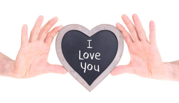 istock Adult holding heart shaped chalkboard 928222302