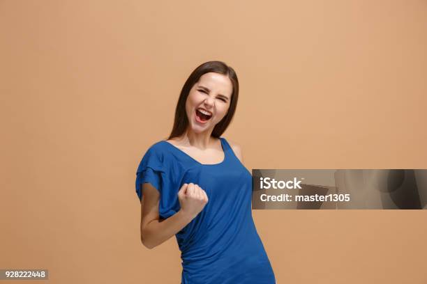 Winning Success Woman Happy Ecstatic Celebrating Being A Winner Dynamic Energetic Image Of Female Model Stock Photo - Download Image Now