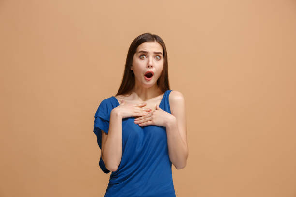 istock Beautiful woman looking suprised isolated on pastel 928222726