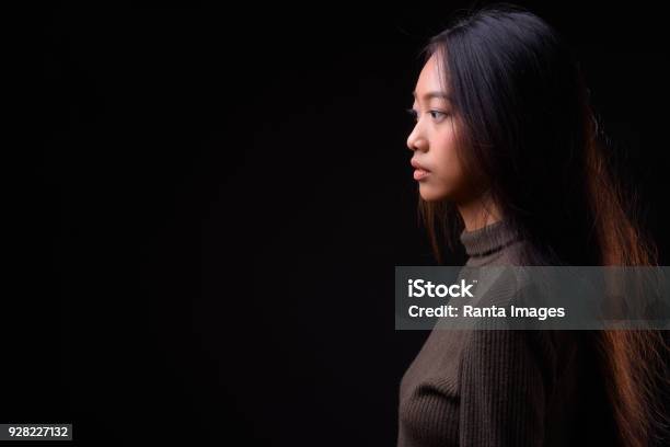 Beautiful Asian Woman Against Black Background Stock Photo - Download Image Now - One Woman Only, Women, Black Background