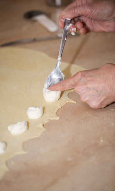 istock Senior woman is preparing homemade pasta. 928230486