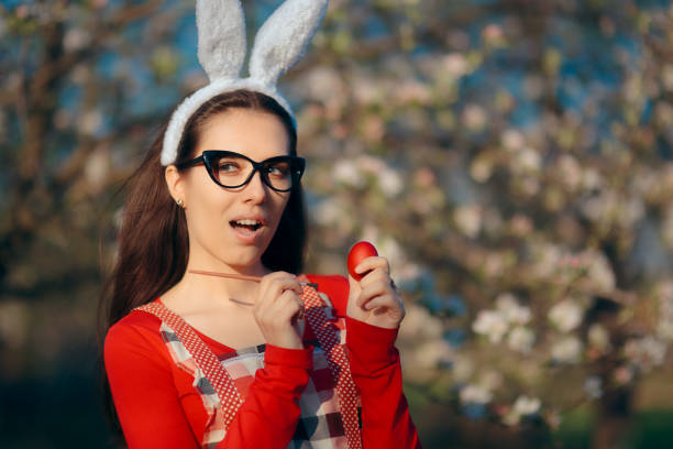 istock Woman Painting Traditional Red Eggs for Easter Celebration 928230968