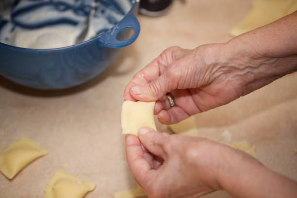 istock Senior woman is preparing homemade pasta. 928231006