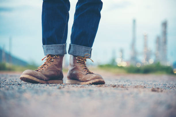 istock Worker wear brown boots standing at refinery 928238822