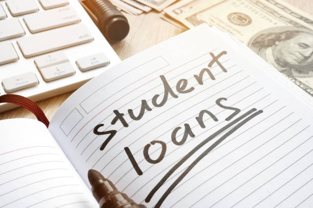 istock Student loan handwritten in a note. Money for education. 928244024
