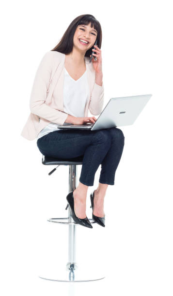 attractive young businesswoman sitting on stool and working - 11193 imagens e fotografias de stock