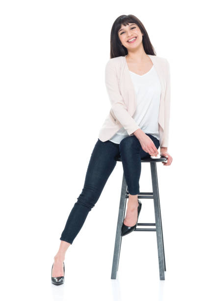 istock Attractive young businesswoman sitting on stool 928247442