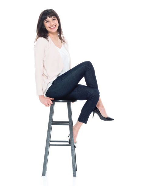 istock Attractive young businesswoman sitting on stool 928247484