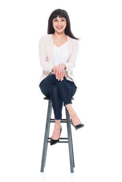 istock Attractive young businesswoman sitting on stool 928248046