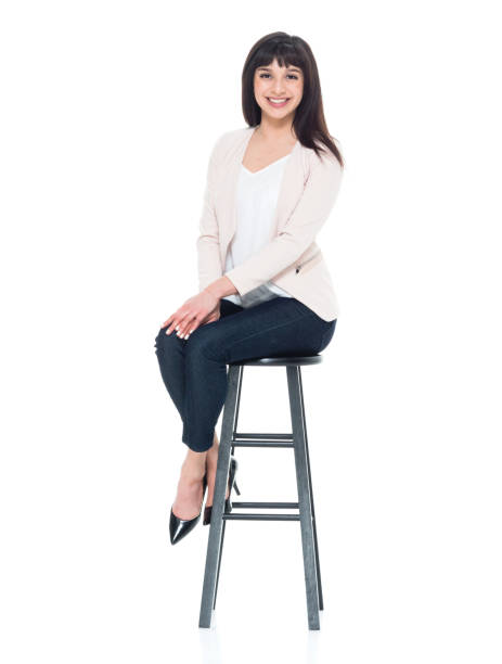 istock Attractive young businesswoman sitting on stool 928248050