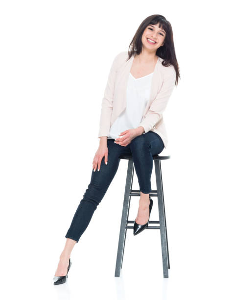 istock Attractive young businesswoman sitting on stool 928248128