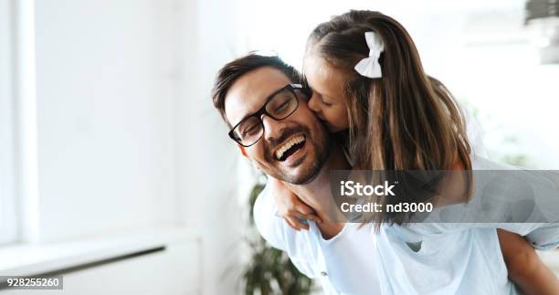 Portrait Of Father And Daughter Playing At Home Stock Photo - Download Image Now - Father, Daughter, Family