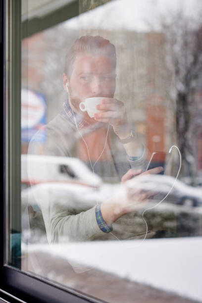 istock Young man enjoying his morning coffee 928256518