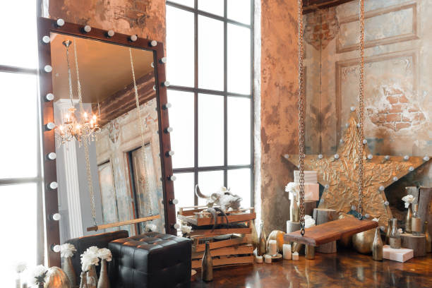 istock Loft interior with mirror, candles, brick wall, large window, living room in modern design 928261408