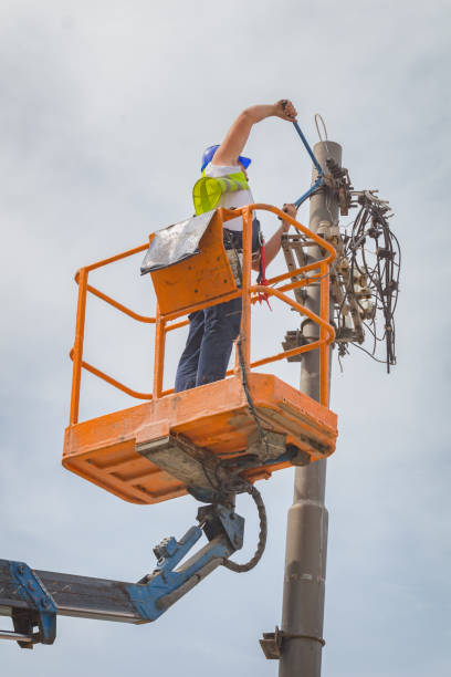 istock Power line worker fixing from the truck basket. 928261846
