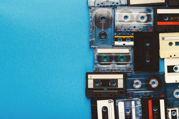 istock Vintage audio cassettes border on blue background 928266054
