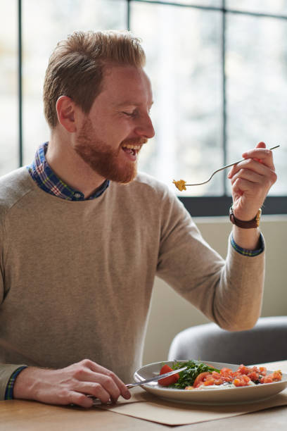istock Young man enjoying healthy breakfast 928267152