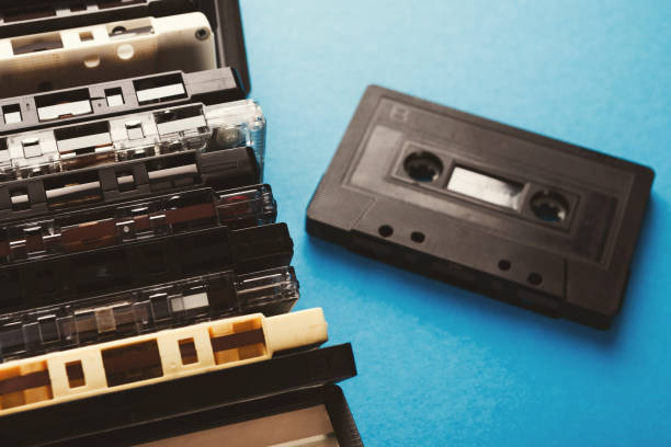 istock Vintage audio cassettes border on blue background 928267268