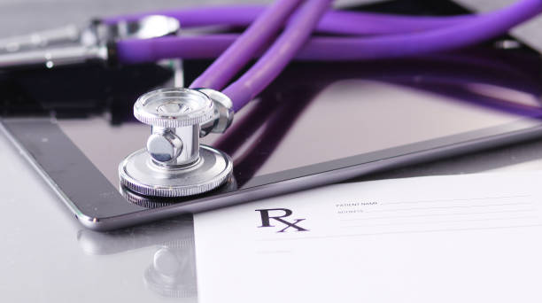 istock Doctor's workspace working table with patient's discharge blank paper form, medical prescription, stethoscope on desk 928268644