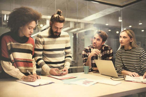istock Group of young freelance workers working in the office. 928269292